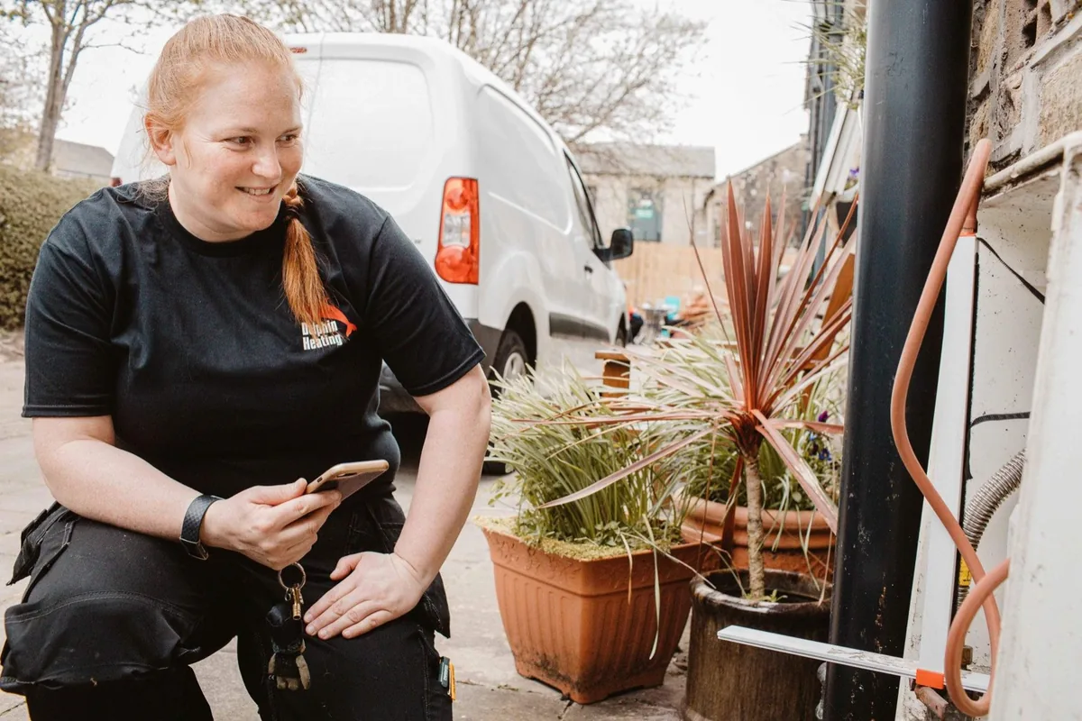 Fay from Dolphin Heating, a Huddersfield gas engineer, working on a boiler